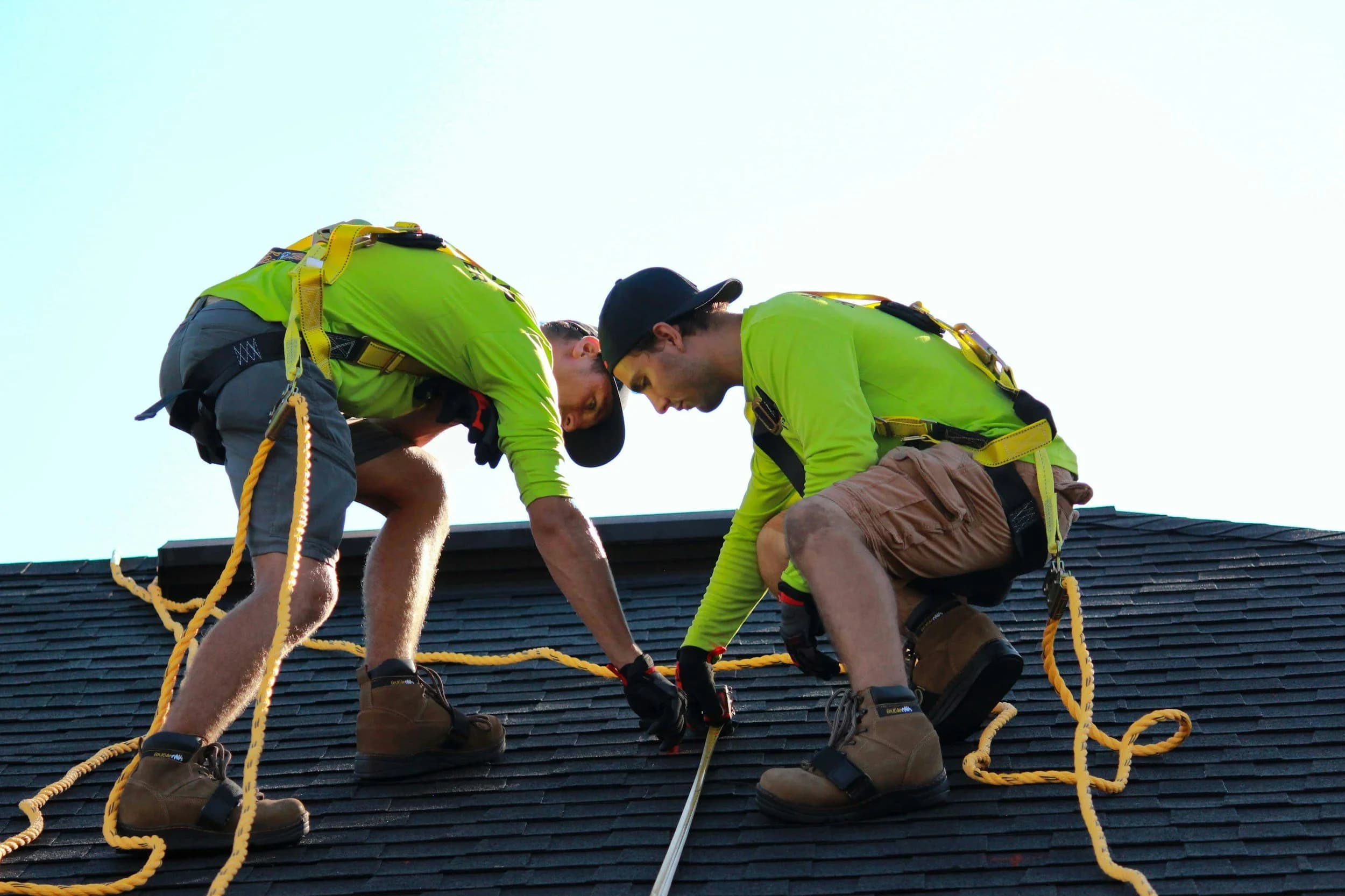 LLH Roofing crew fastening a ridge line